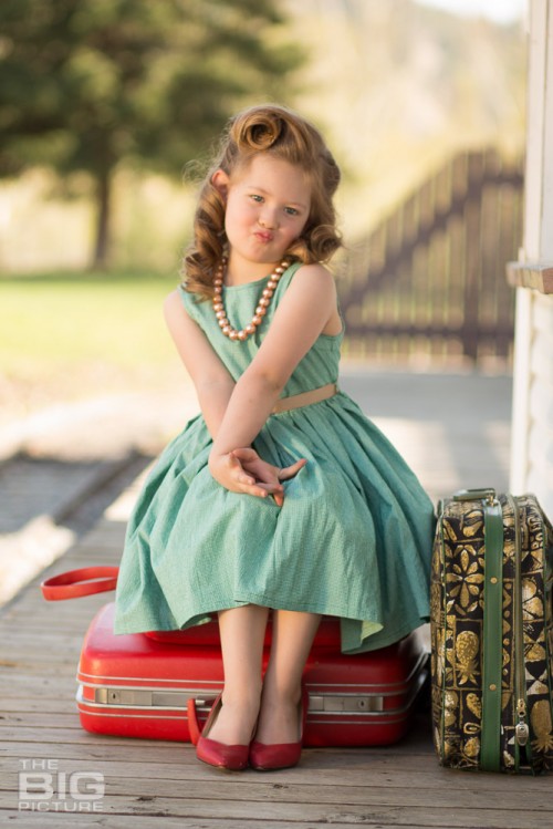children's portraits, children's photography, vintage recreation photos, little girl with luggage waiting at train station, victory rolls
