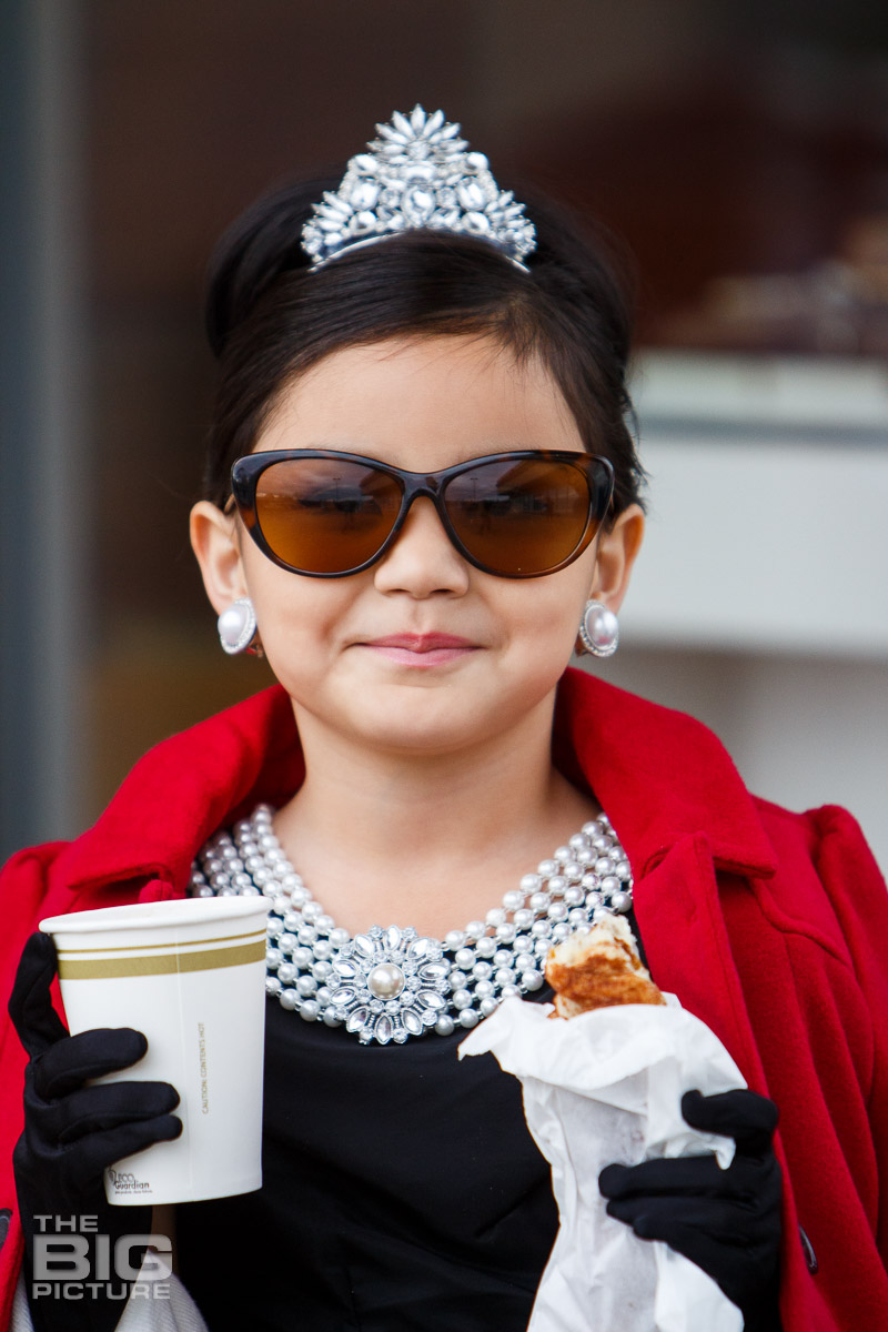 Ava wearing a tiara and holding coffee and a doughnut - kids photography - children's photography