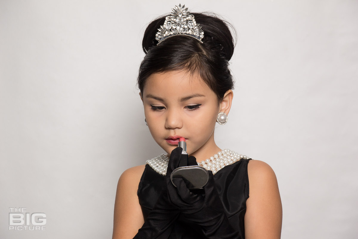 Ava putting on makup like Audrey Hepburn in a scene from breakfast at Tiffany's  - kids photography - children's photography
