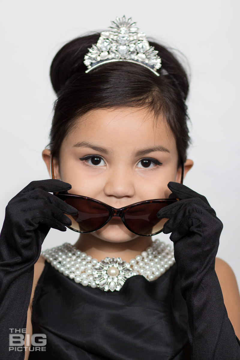 Ava dressed up like Audrey Hepburn in a scene from breakfast at Tiffany's  - kids photography - children's photography