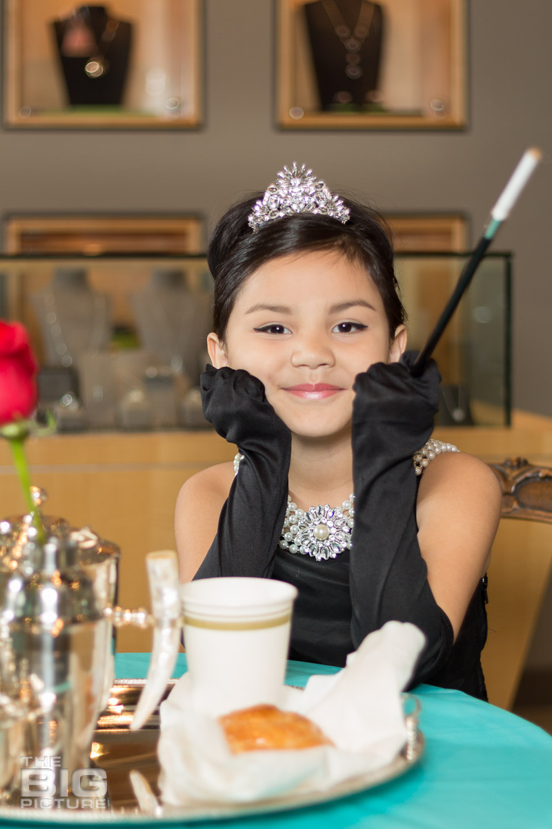 Ava - young girl with a tiara on sitting in a jewellery shop - kids photography - children's photography