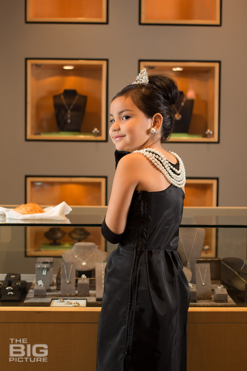 Ava standing at the jewellery shop looking at necklaces - children's photography - kids photography