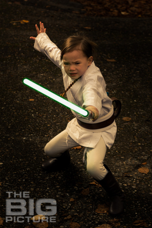 female Jedi with drawn lightsaber, children's cosplay - Children's Photography