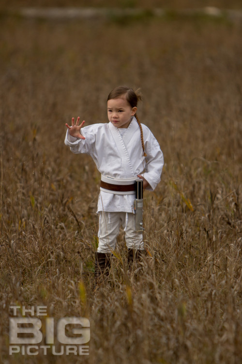 Jade the Jedi, girl Jedi using the force in a grassy field with a lightsaber, children's cosplay - Children's Photography