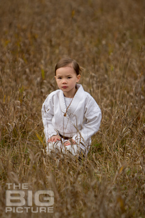 Jade the Jedi, girl padawan kneeling in a grassy field, female Jedi - Children's Photography